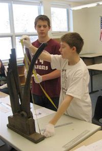 Students measuring an item